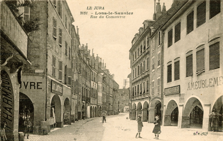 Lons-le-saunier (Jura). 2081. La rue du Commerce. Imprimerie Catala Frères.